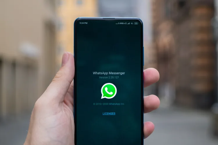 customer holding phone and using whatsapp